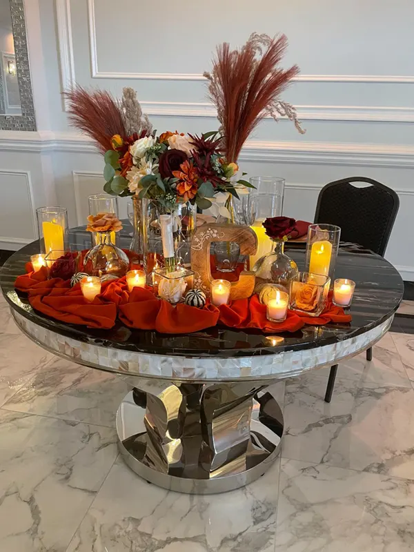 Table with decorations, candles and treats
