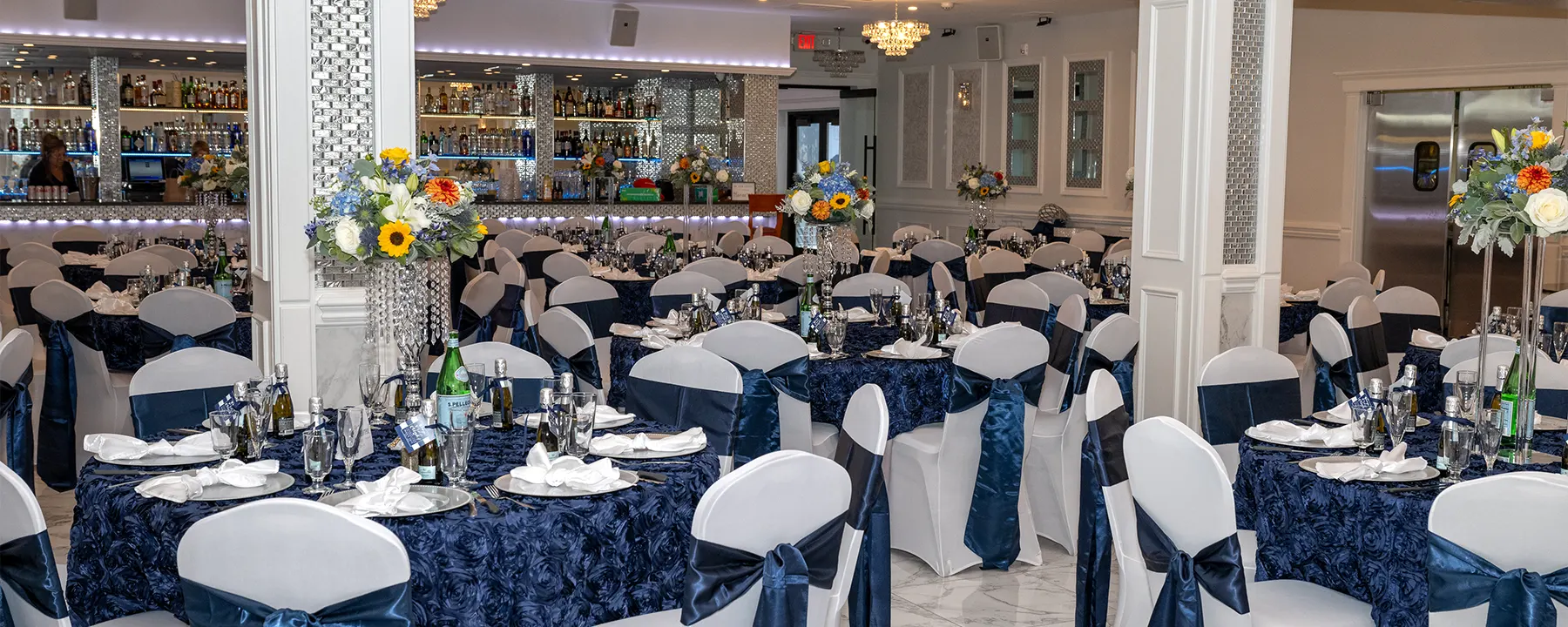 Overview of room with beautiful blue and white table settings